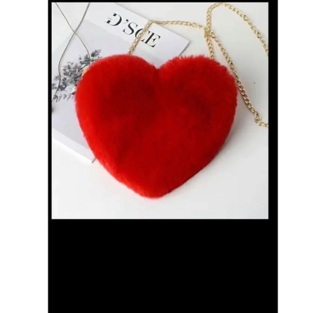 Fuzzy heart shaped gold chain, pocket book with front zipper .